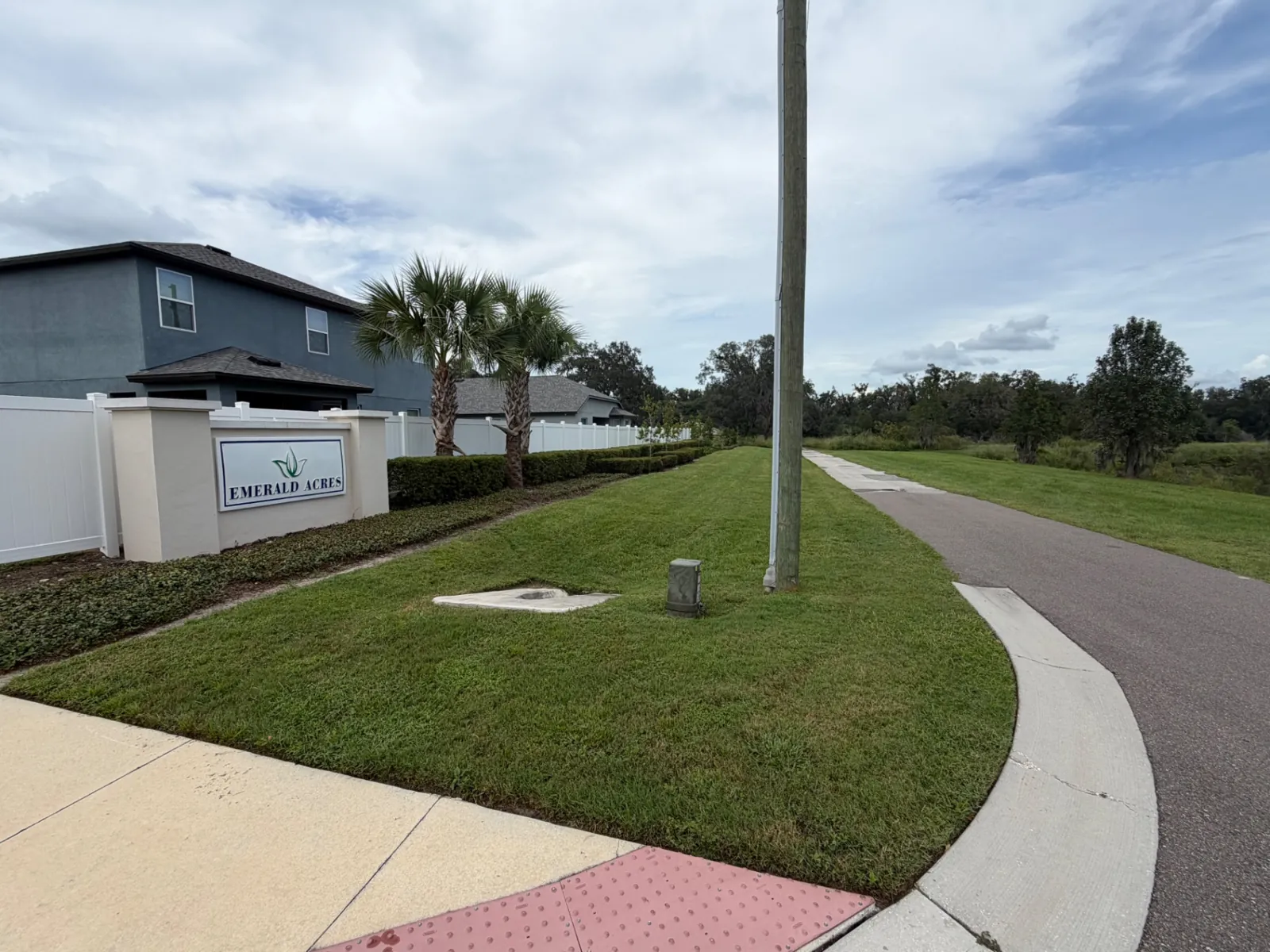 Maintained Emerald Acres community entrance and lawn