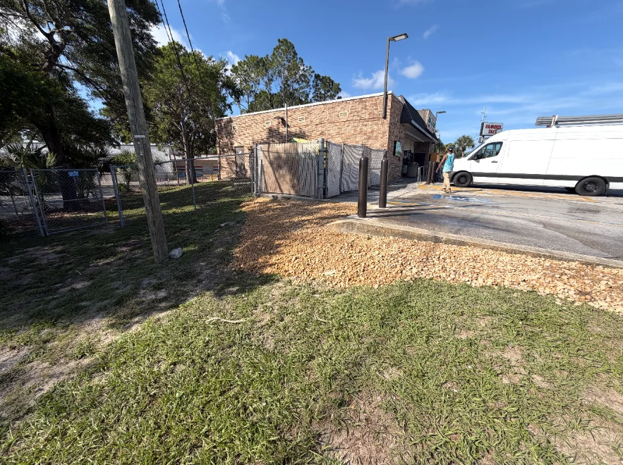 Rock bed and mowed grass at a commercial property