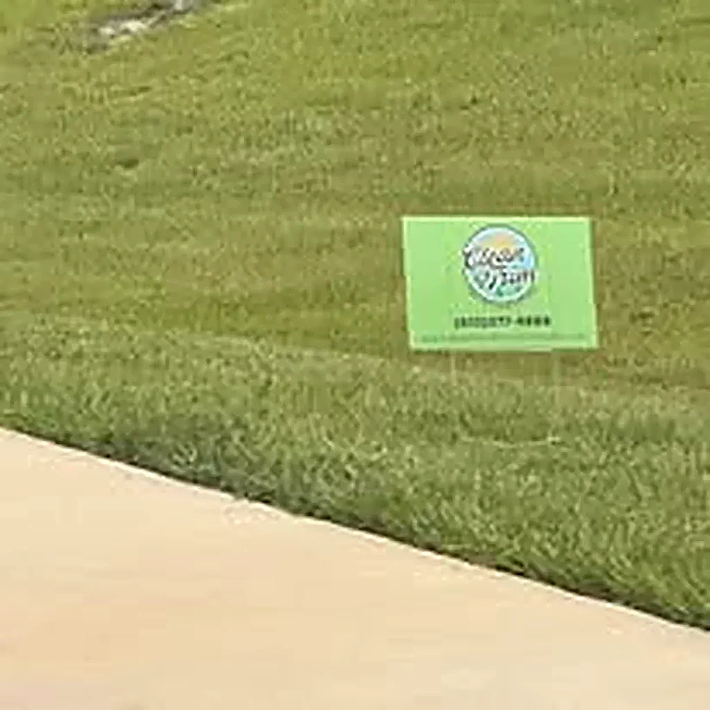 Clean & Trim lawn sign beside a freshly maintained yard