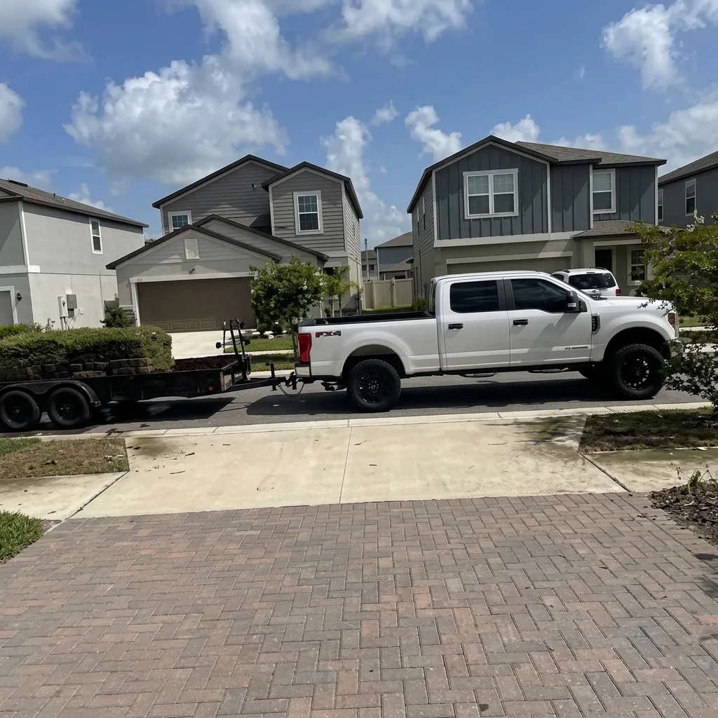 Clean & Trim truck and trailer outside a freshly serviced home